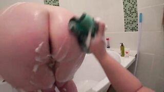 Lesbian fucks mature milf in the bathroom, a bottle in a hairy pussy and appetizing big ass shakes, juicy butt trembles, POV.