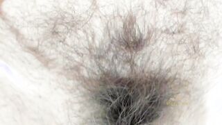 Mature woman fucking hairy pussy while waiting dick