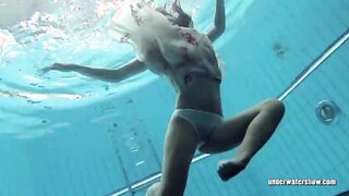 Lucy strips underwater and shows hairy vagina