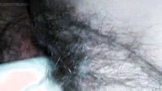 Hairy milf pampers her pussy with latex gloves