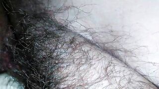 Hairy milf pampers her pussy with latex gloves