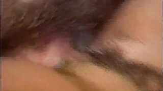 Busty ebony gets her hairy pussy drilled by a man with long hair on the bed